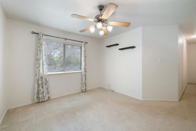 Spare room with baseboards, a ceiling fan, and carpet flooring | Image 33