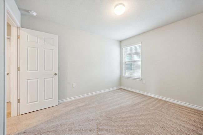 Empty room featuring carpet floors and baseboards | Image 17
