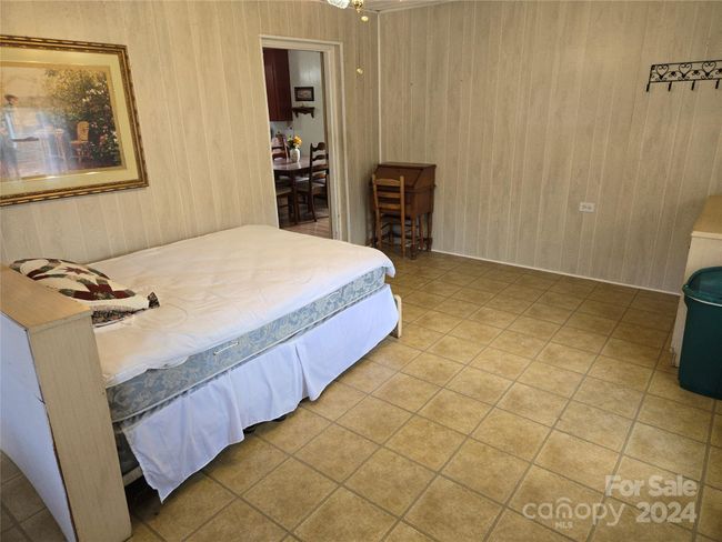 This bonus room is unheated but does have propane piped in as well as window A/C. | Image 17