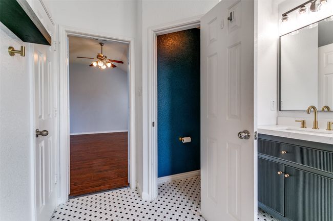 This bathroom has a separate toilet area (with a door) and a linen closet for extra storage. | Image 22
