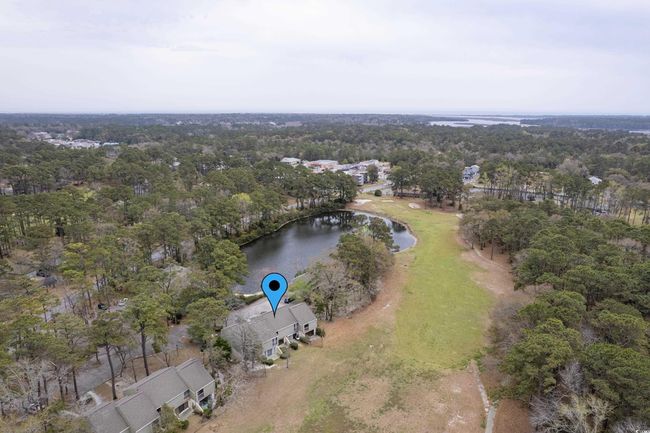 Drone / aerial view with a water view and a wooded view | Image 32