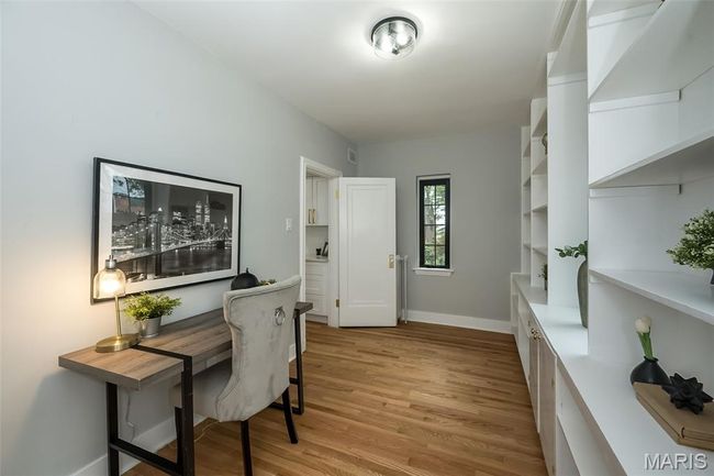 Office area featuring light wood-style floors and baseboards | Image 18