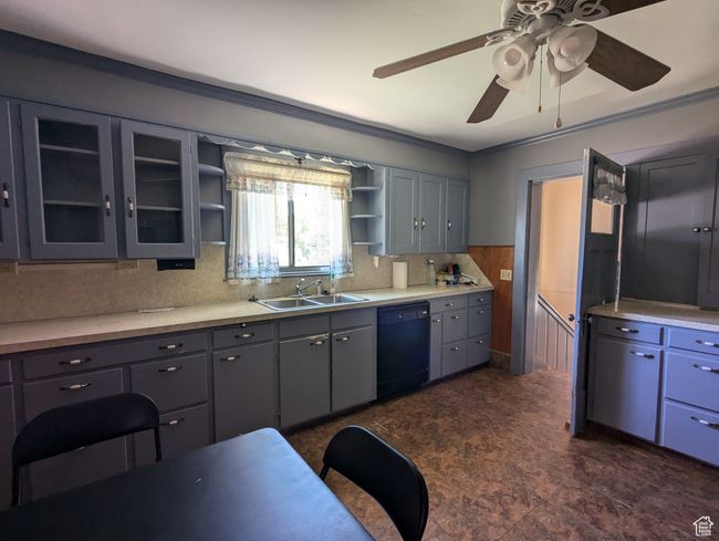 Kitchen with a ceiling fan, open shelves, a sink, light countertops, and dishwasher | Image 8