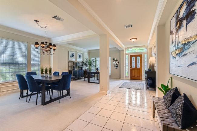 Extended tile entry with 2 step crown molding and wall for decorative art work | Image 8