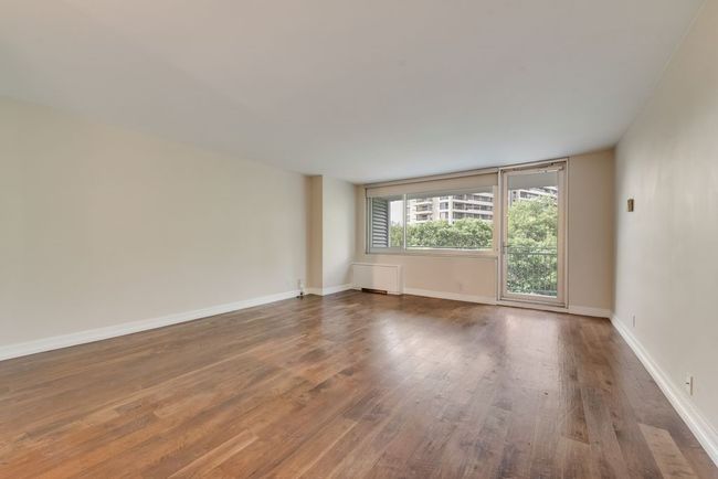 Wood floors throughout common space. Roller shades help set the tone. | Image 5