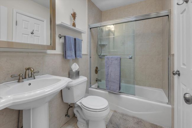 Full bath accessible from shared hallway and primary bedroom | Image 7