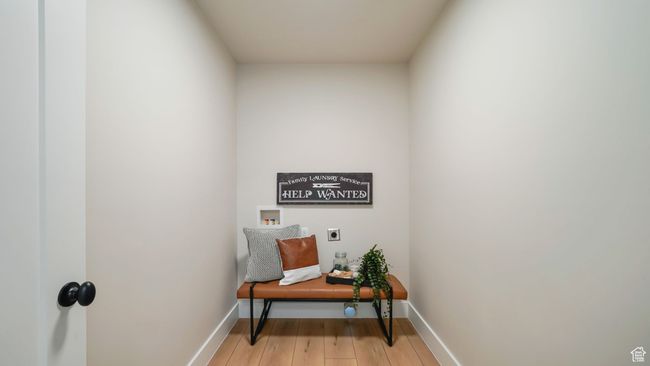 Washroom with hookup for an electric dryer, washer hookup, and light wood-style floors | Image 13
