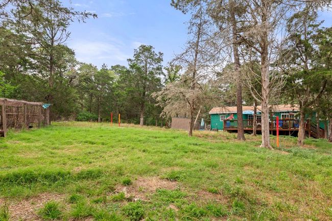 View of yard with a wooden deck | Image 21
