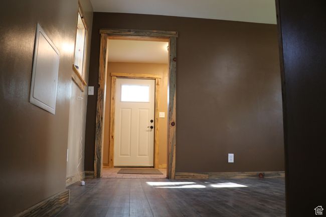 Entryway featuring wood finished floors and baseboards | Image 18