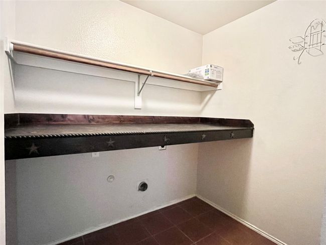 Laundry area featuring hookup for an electric dryer and baseboards | Image 27
