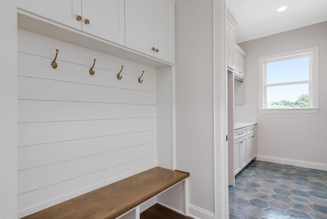 Mudroom with baseboards and ornamental molding | Image 24