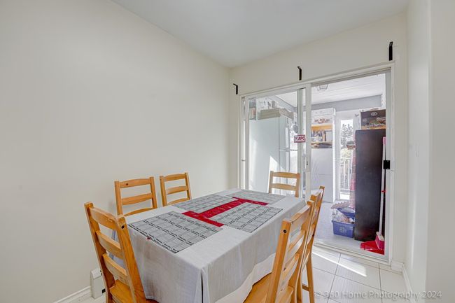 Dining room featuring tile patterned floors and baseboards | Image 7