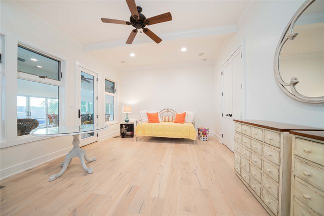 Bedroom with crown molding, light wood-style flooring, recessed lighting, and ceiling fan | Image 32