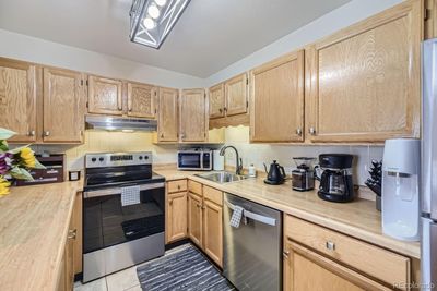 Nothing missing in this fabulous kitchen! Stainless steel appliances, loads of storage, and plenty of room if there are 2 cooks in the kitchen. | Image 3