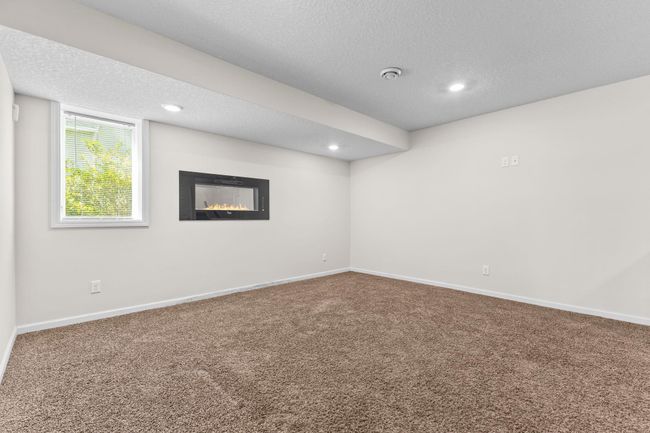 Another view featuring fireplace | Image 43