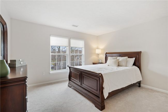 Nicely sized guest bedroom with neutral decor. | Image 15