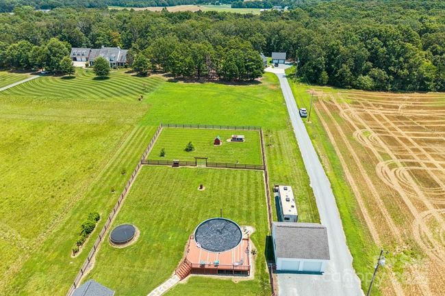 Property line ends past the second fenced in area | Image 28
