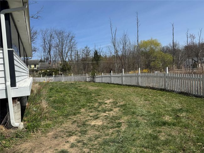 View of yard featuring fence | Image 31