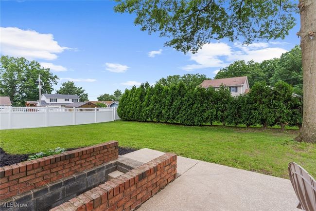 Fenced backyard featuring a patio area | Image 40