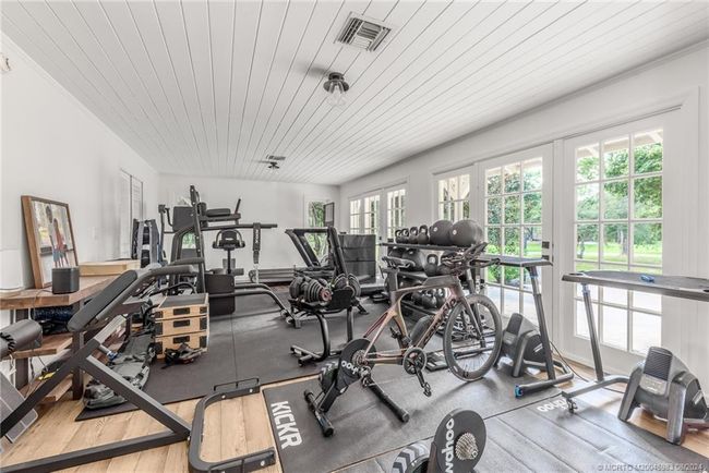 Guest Quarters lower living area/bedroom (being used as storage and gym) | Image 47