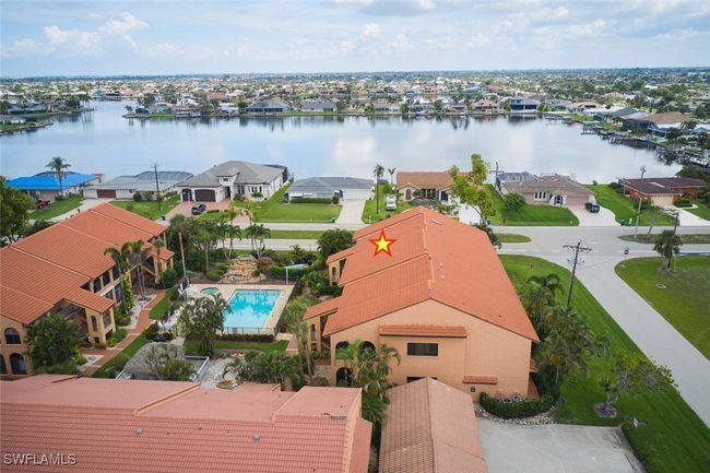 Aerial perspective of suburban area featuring a large body of water | Image 34