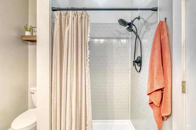 Full bathroom featuring a tile shower | Image 21