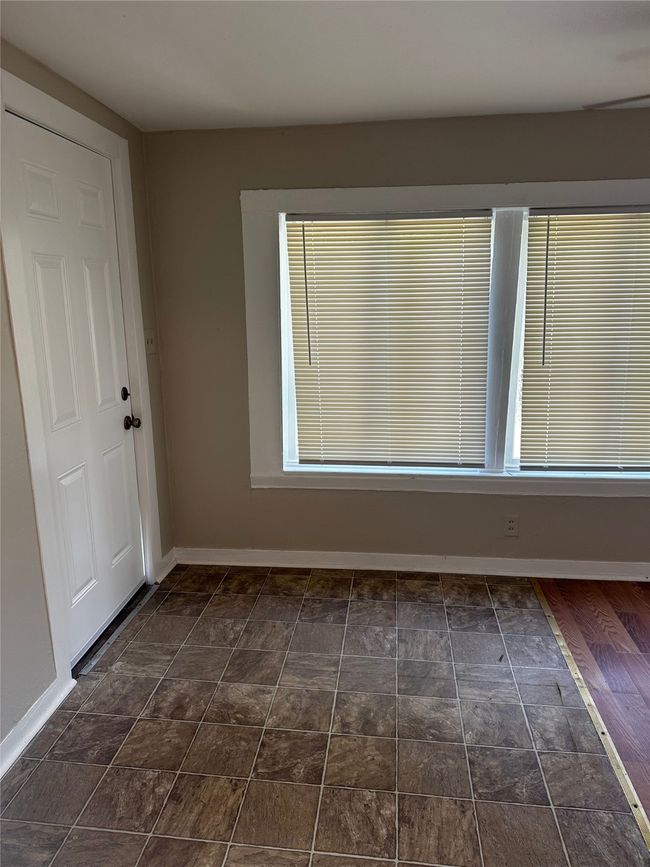 Unfurnished room featuring dark hardwood / wood-style floors | Image 5