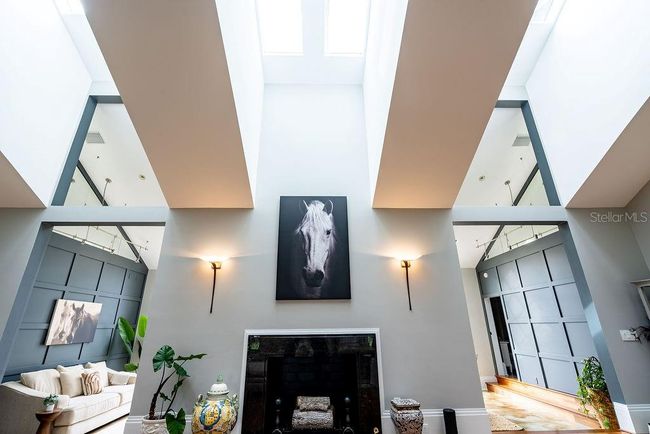 Great room fatures both gas and wood-burning fireplace options, along with an expansive display wall perfect for showcasingd artwok or treasured pieces. | Image 19
