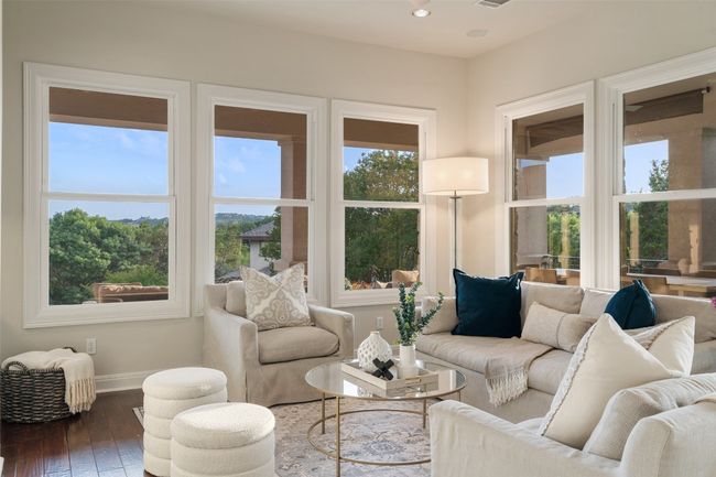 Living area featuring wood-type flooring and baseboards | Image 12