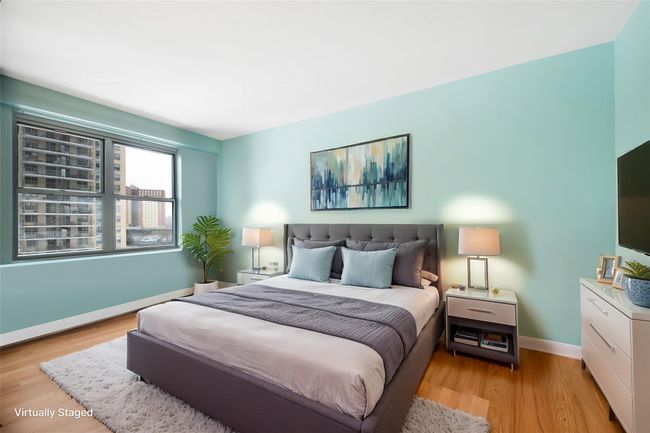 Bedroom featuring light hardwood / wood-style floors | Image 6