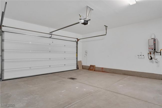 Garage featuring a garage door opener | Image 6