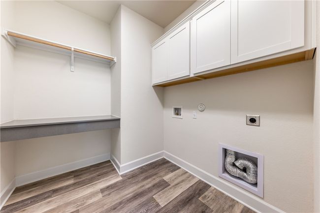 Large, dedicated laundry room and work area. | Image 23