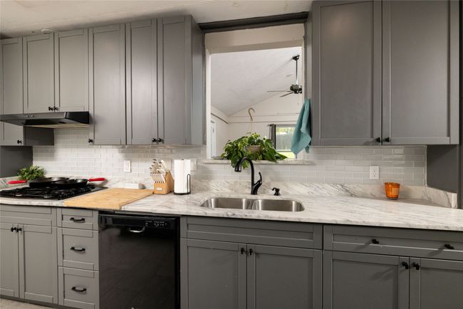Kitchen featuring a sink, black appliances, and gray cabinets | Image 14