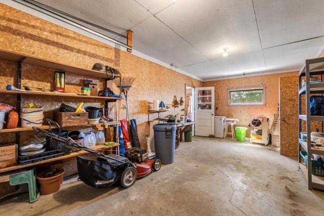 Garage with a Breeze Way/ Mud Room, providing covered access to the home. | Image 27