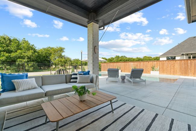 Fenced backyard featuring an outdoor hangout area and a patio | Image 34