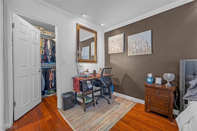 Home office with a textured wall, crown molding, baseboards, and wood finished floors | Image 16