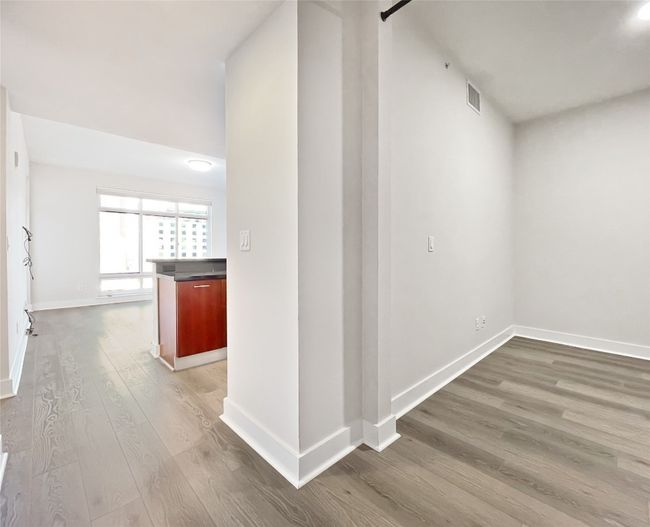Hall with wood finished floors and baseboards | Image 7