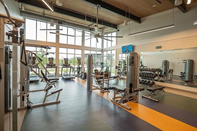 Trinity Falls Gym featuring a ceiling fan with towering wood ceilings | Image 35