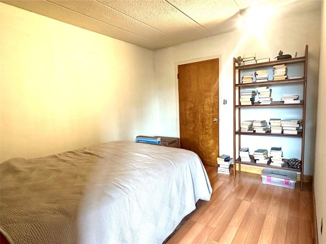 Bedroom featuring wood finished floors | Image 5