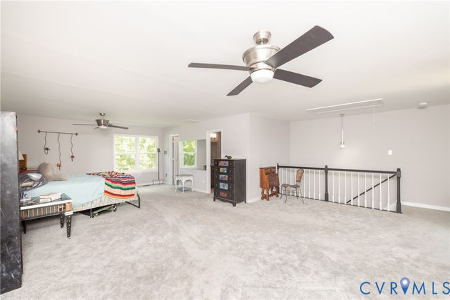 Carpeted bedroom with attic access and a ceiling fan | Image 41