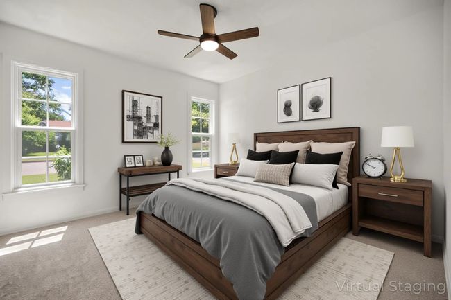 Bedroom with light carpet and ceiling fan | Image 9