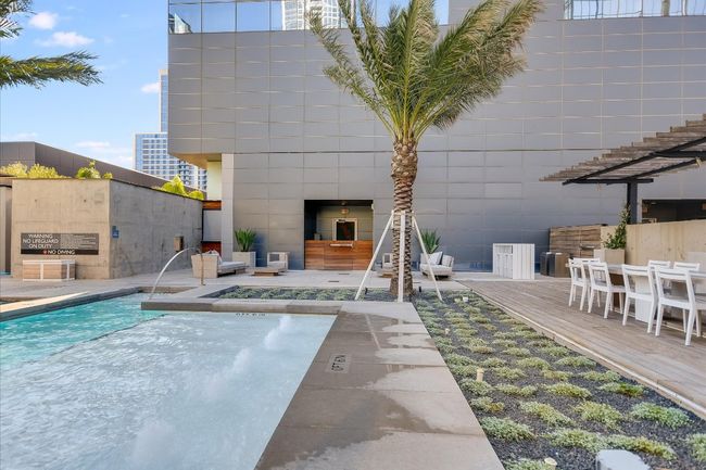 Sun-drenched by day and dramatically lit at night, the pool deck is a sophisticated retreat in the heart of downtown. | Image 32