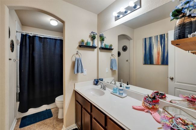 Full bathroom next to guest bedrooms and office with extended vanity. | Image 23