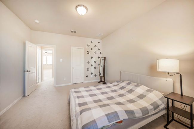 Bedroom with light colored carpet and baseboards | Image 32