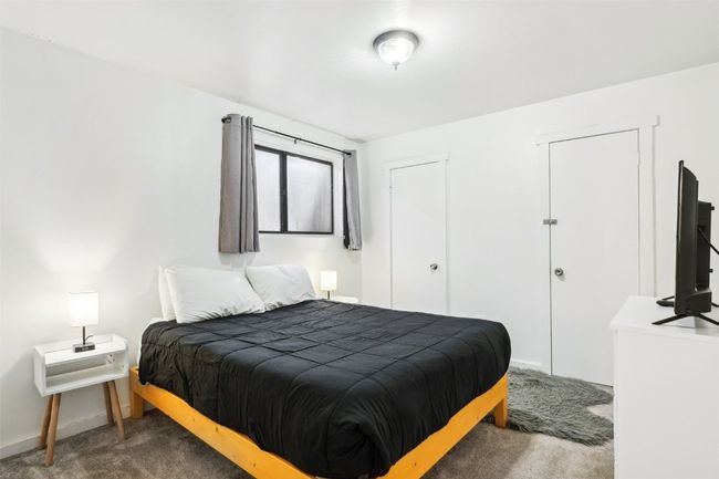 Carpeted bedroom with baseboards | Image 19