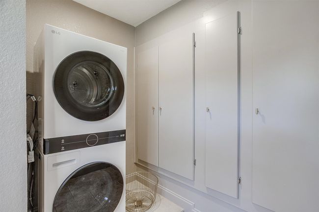 Washroom with estacked washer and dryer | Image 33