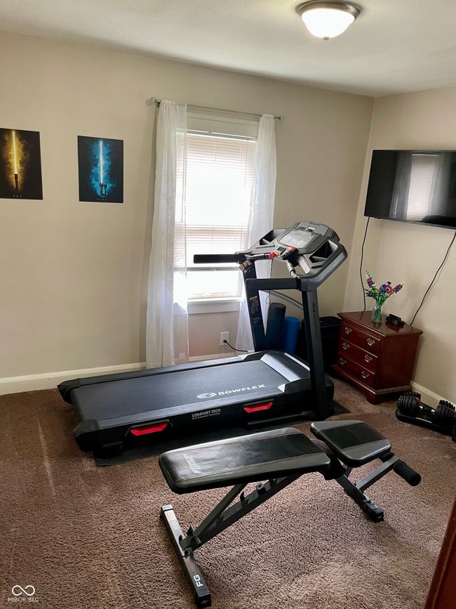 workout room featuring baseboards and carpet | Image 18
