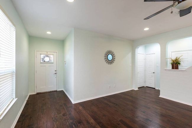 Foyer featuring ceiling fan, wood finished floors, recessed lighting, and arched walkways | Image 18