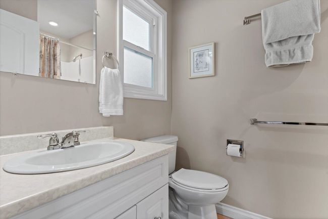Bathroom featuring vanity and a shower with shower curtain | Image 25