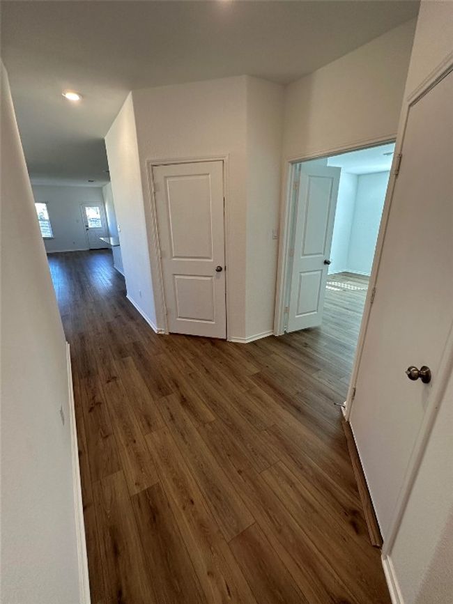 Hall with baseboards, recessed lighting, and dark wood-type flooring | Image 20